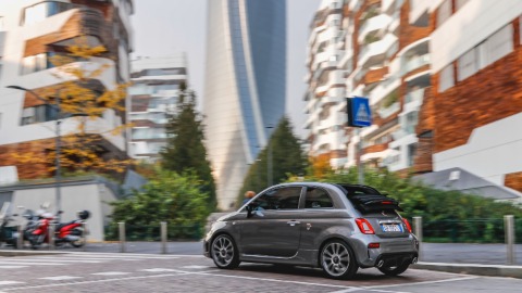Rear of a Grey Abarth 595 Turismo Driving in City