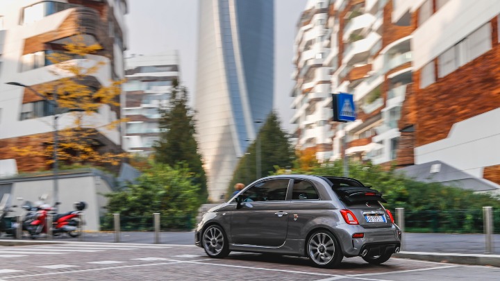Rear of a Grey Abarth 595 Turismo Driving in City