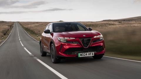 Red Alfa Romeo Junior driving