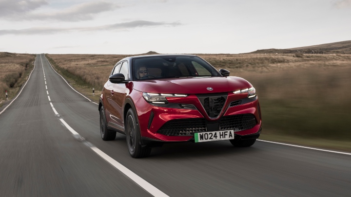 Red Alfa Romeo Junior driving