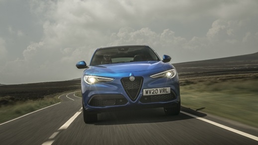 Blue Alfa Romeo Stelvio Exterior Front Driving Straight On