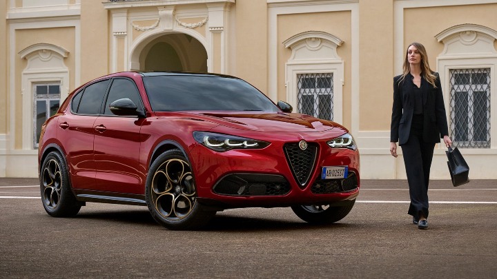 Red Alfa Romeo Stelvio Exterior Front Static with Woman