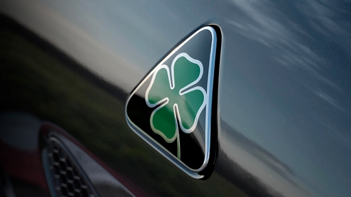 Alfa Romeo Quadrifoglio Emblem on Green Car