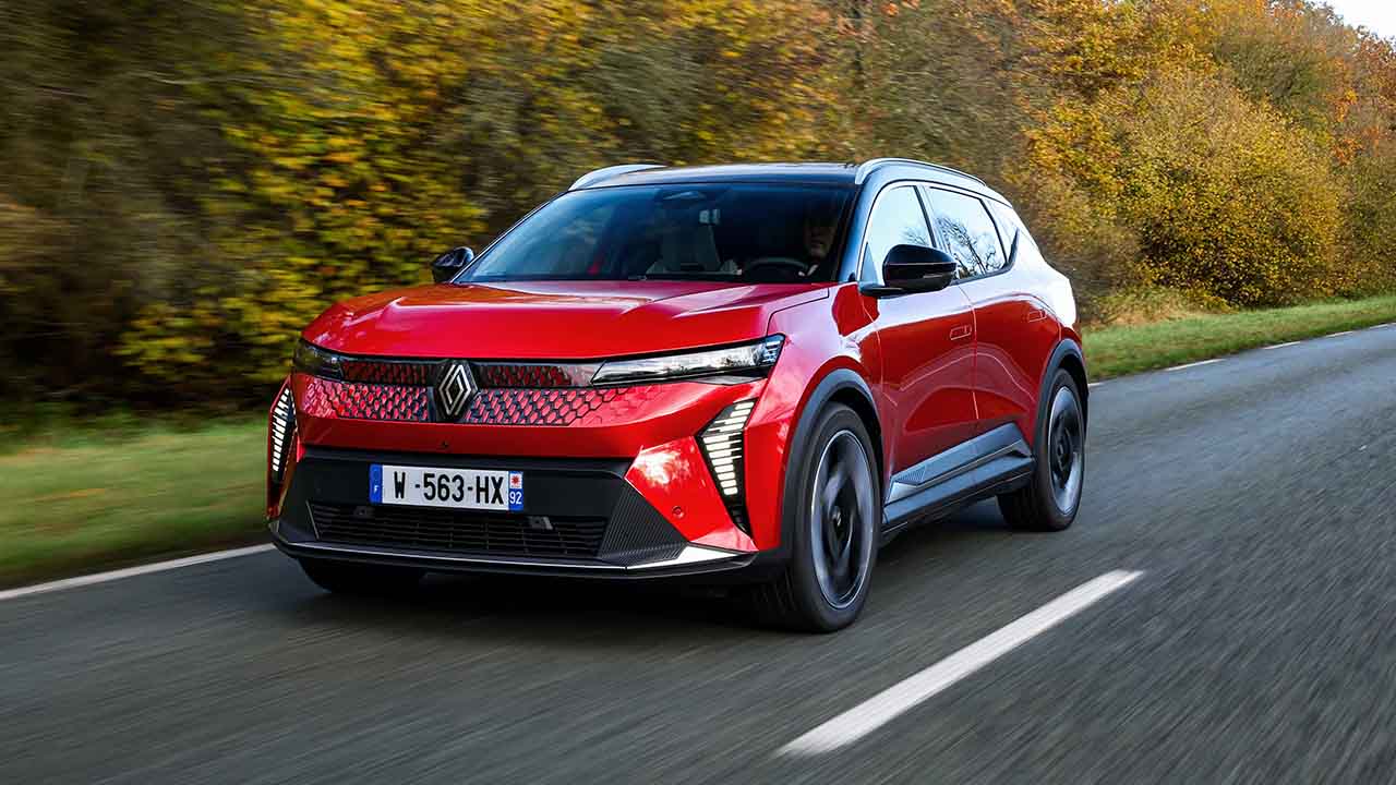 Red Renault Scenic E-Tech Driving On Road