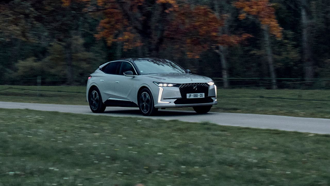 White DS 4 driving in the countryside