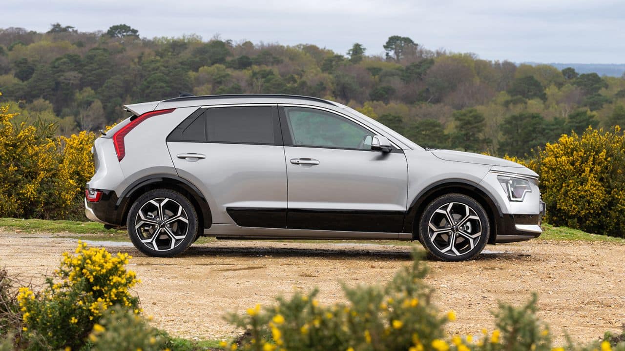 Silver Kia Niro parked in the countryside