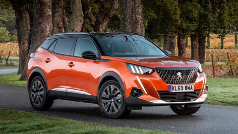 orange peugeot 2008, front, parked