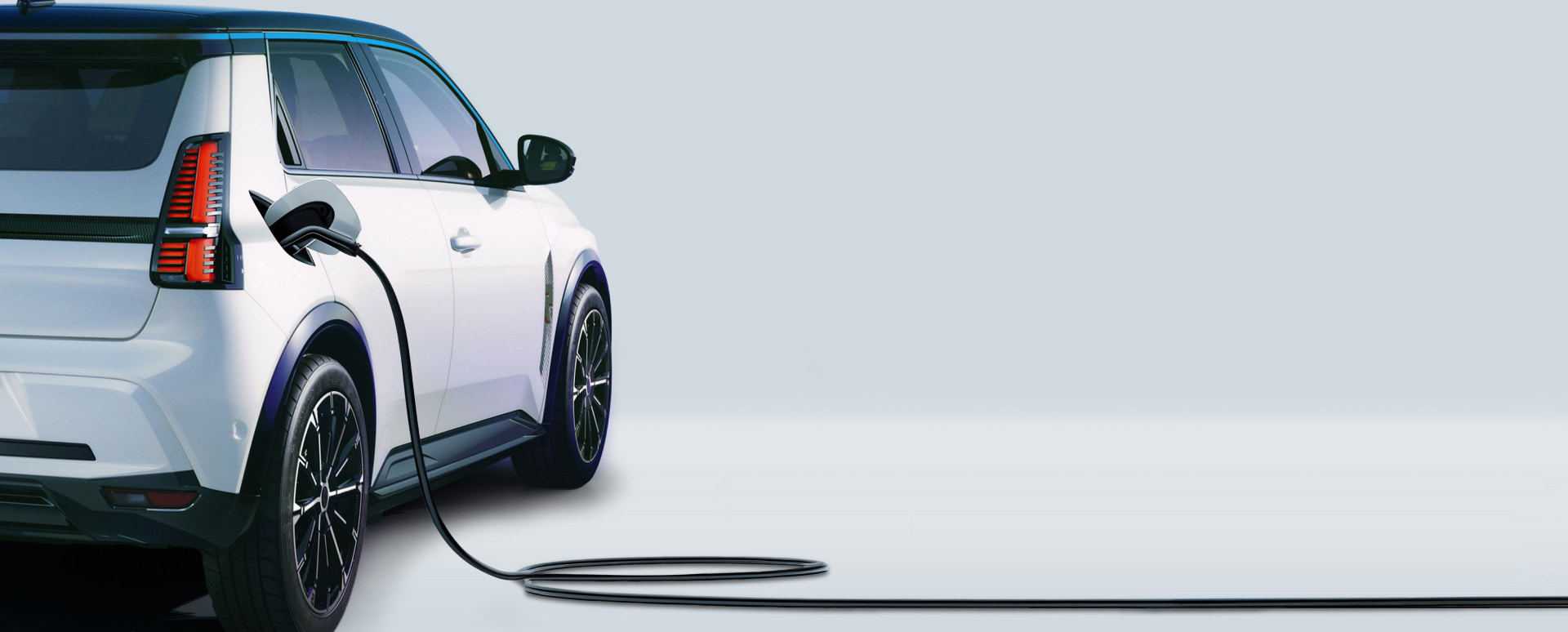 Renault 5 Exterior Rear Charging in Studio