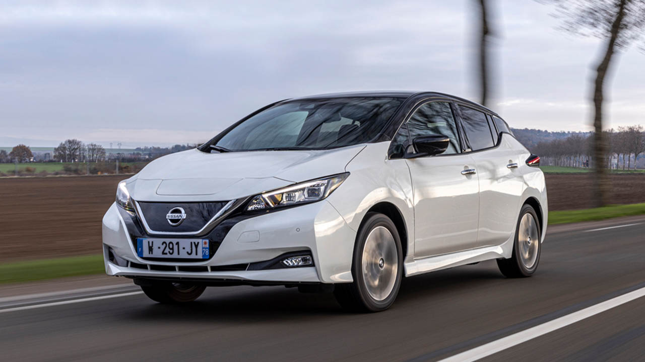 White Nissan LEAF, driving in countryside