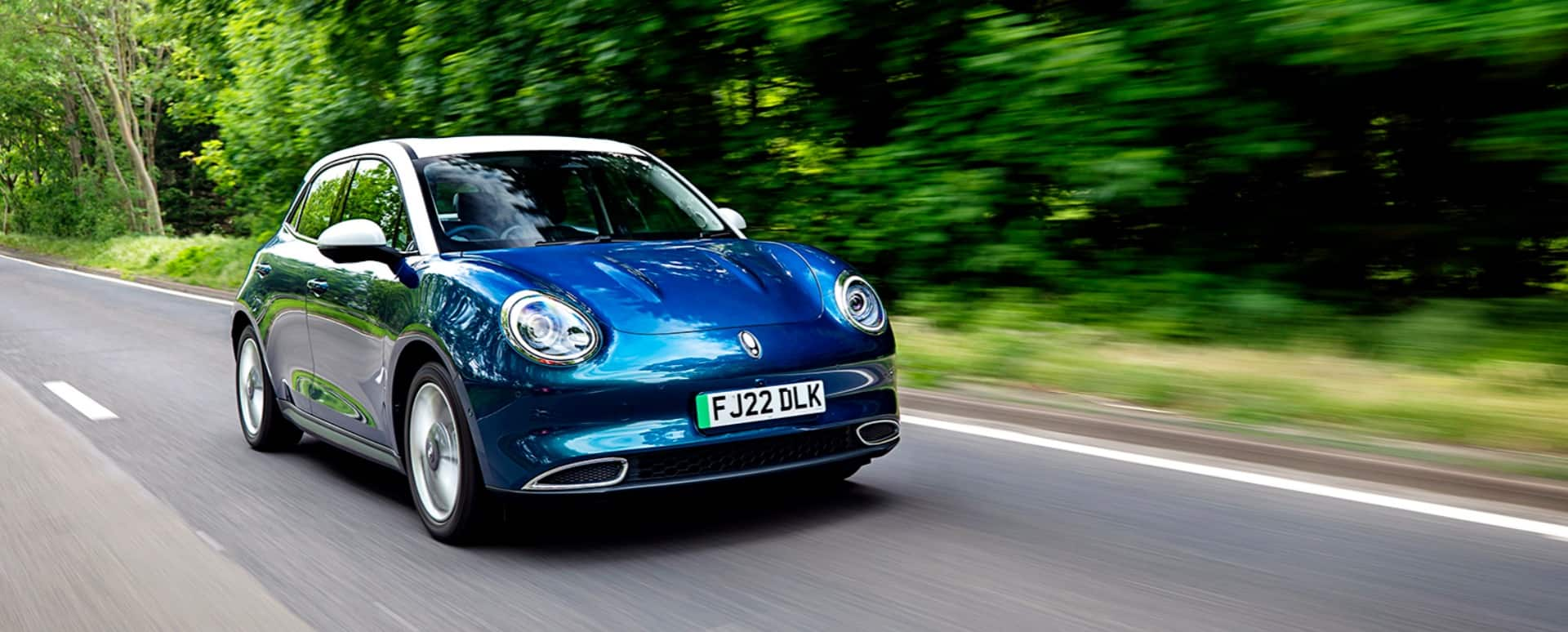 Blue car on a beautiful country road