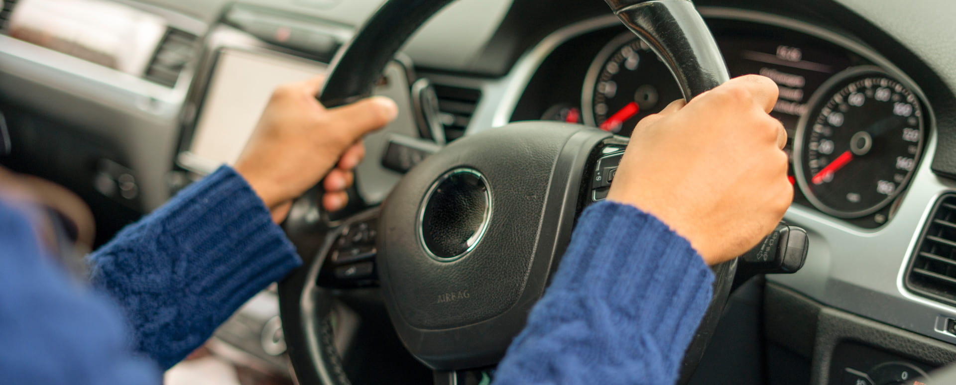 Woman's Hands On Steering Wheel