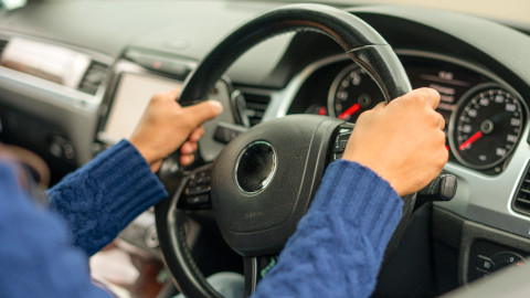 Woman's Hands On Steering Wheel