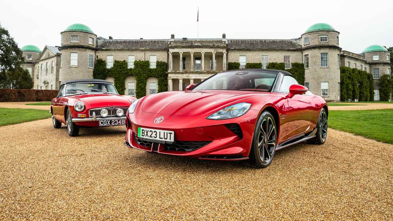 Red MG Cyberster next to classic MG