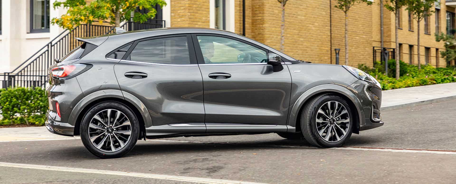 Silver Ford Puma driving in the city