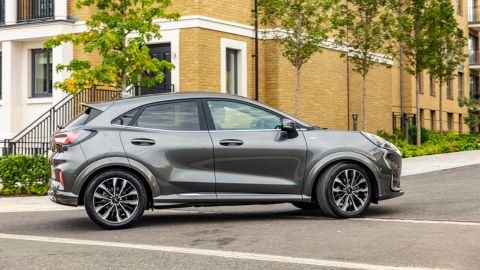 Silver Ford Puma driving in the city