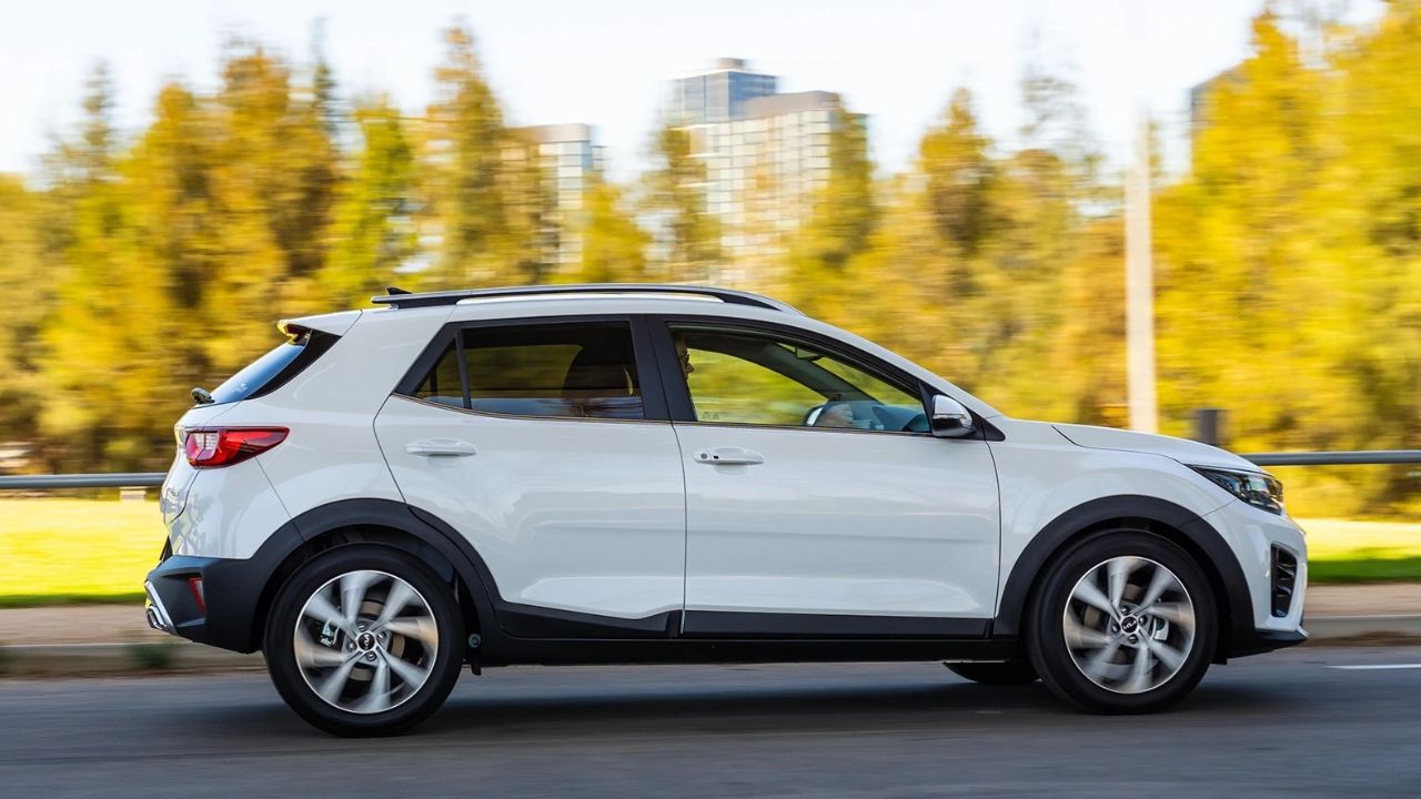White Kia Stonic driving on the motorway
