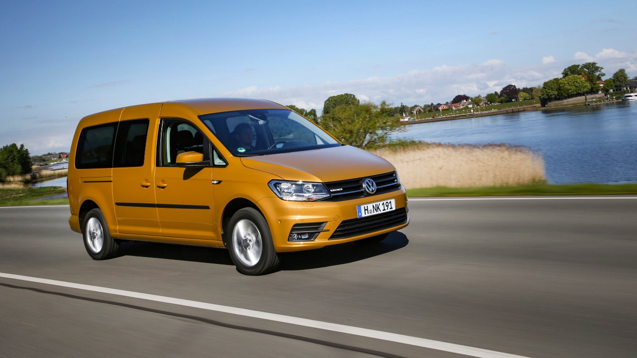 Gold Volkswagen Caddy driving