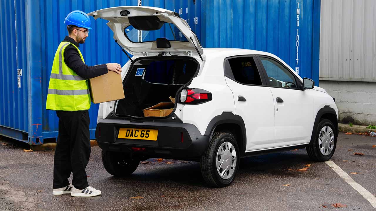 White Dacia Spring cargo loading at the rear