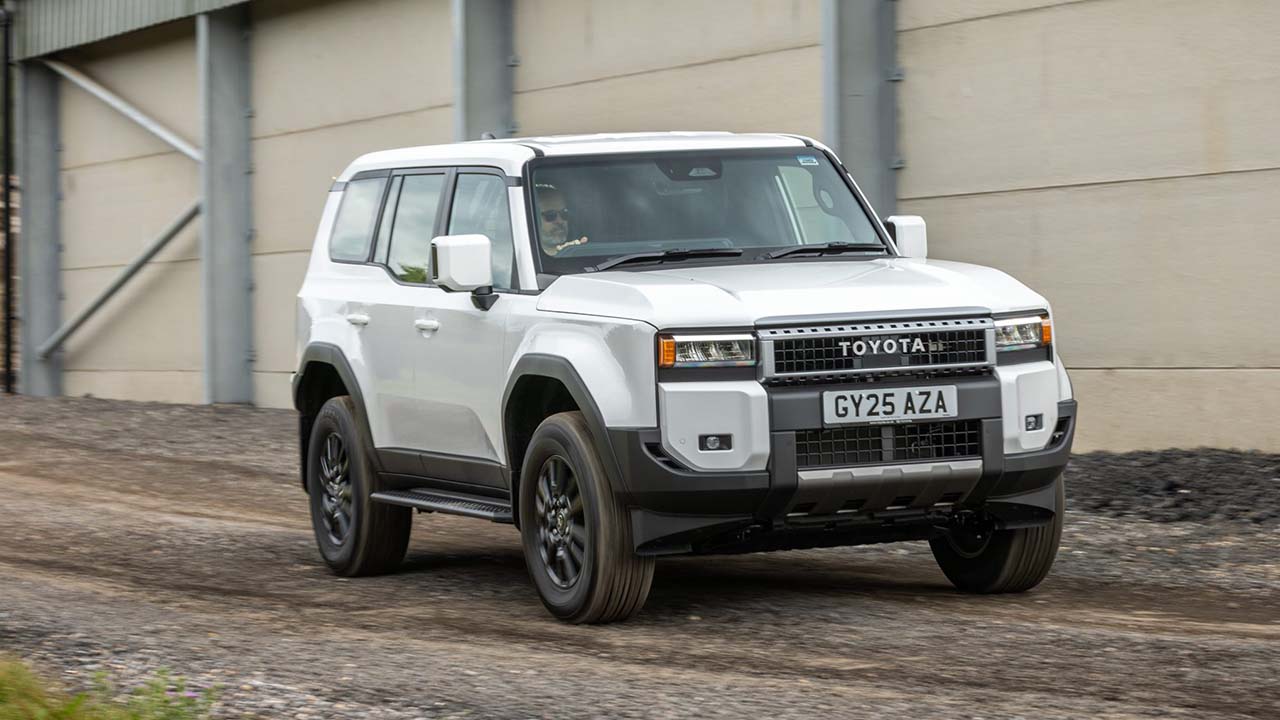 White Toyota Land Cruiser commercial driving