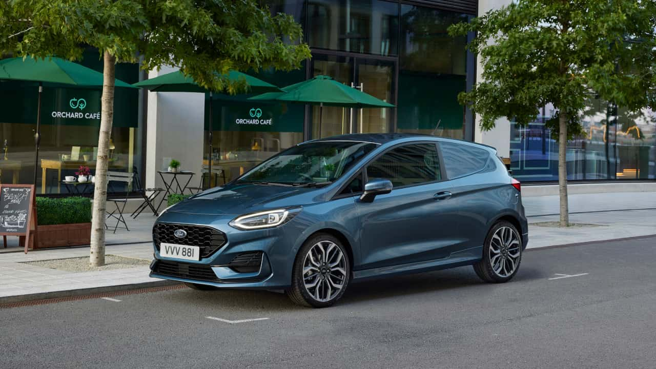 Blue Ford Fiesta Van Exterior Front Driving