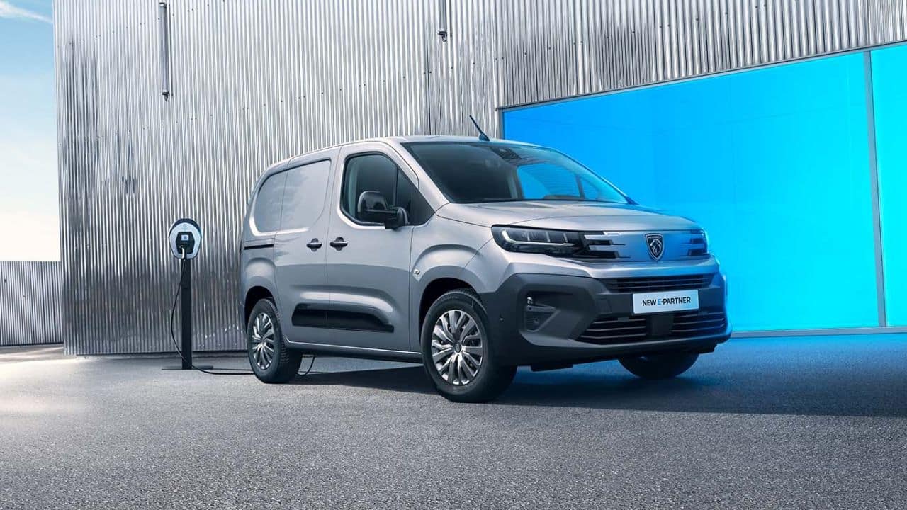 Silver Peugeot being charged