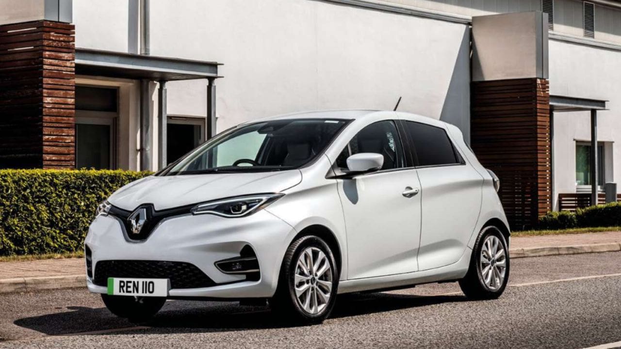 White Renault ZOE van parked in front of a house