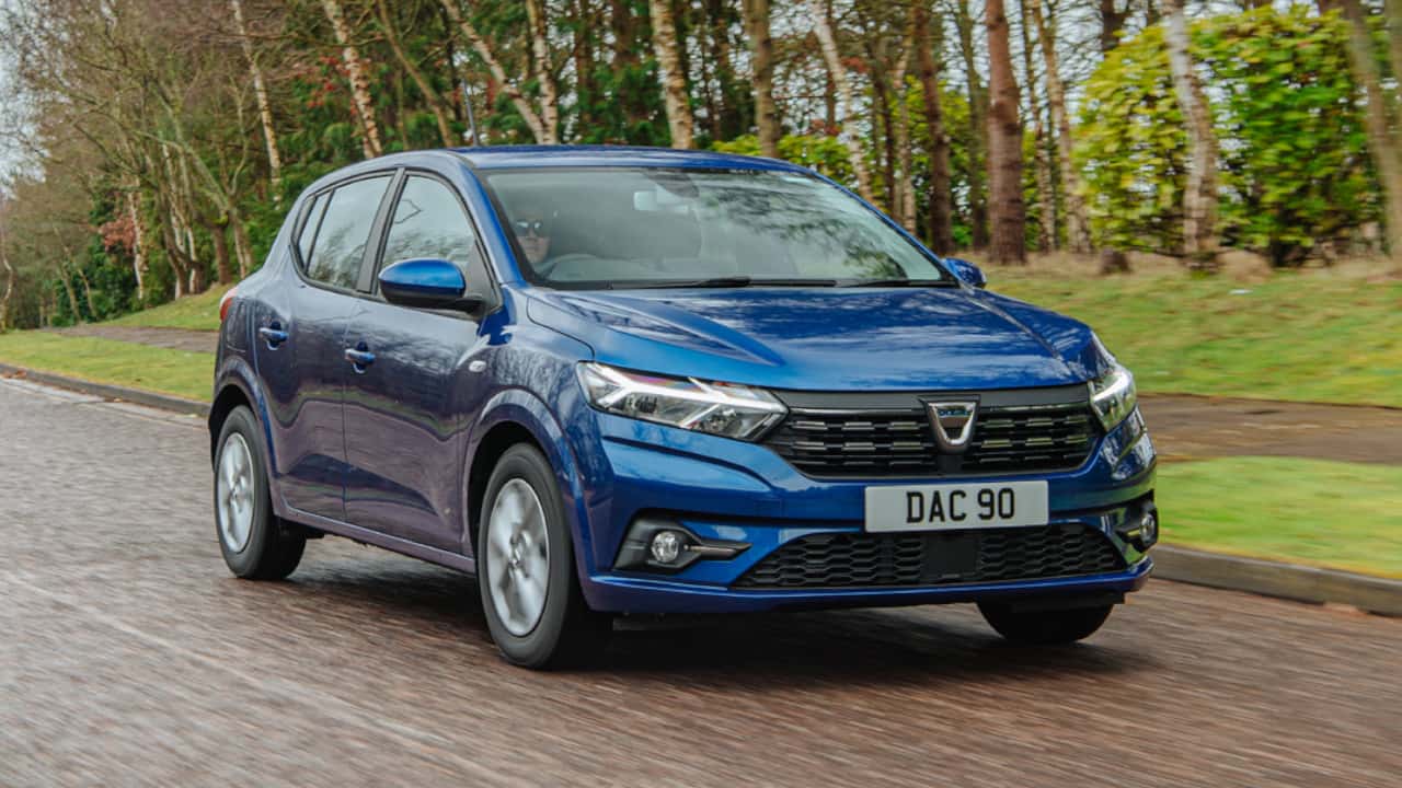 Blue Dacia Sandero Driving On Road