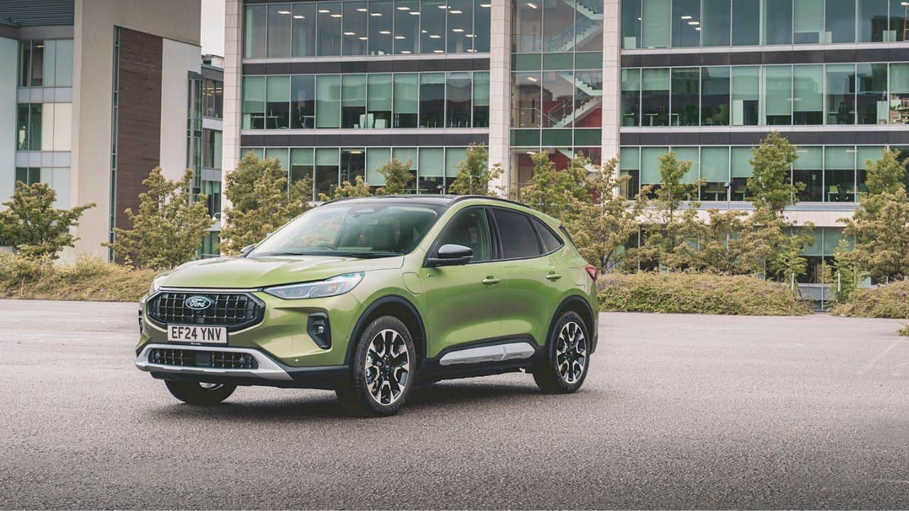 Ford Kuga parked in front of a modern building