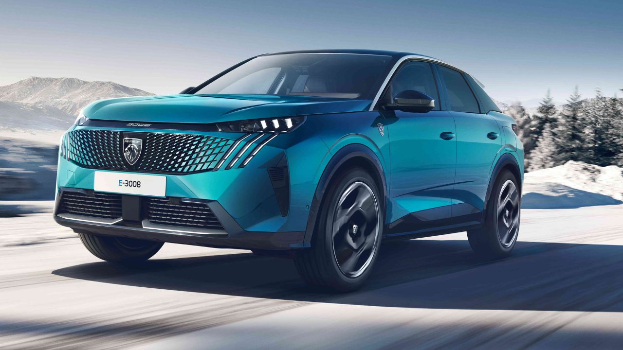 Blue Peugeot E-3008 driving in the snow