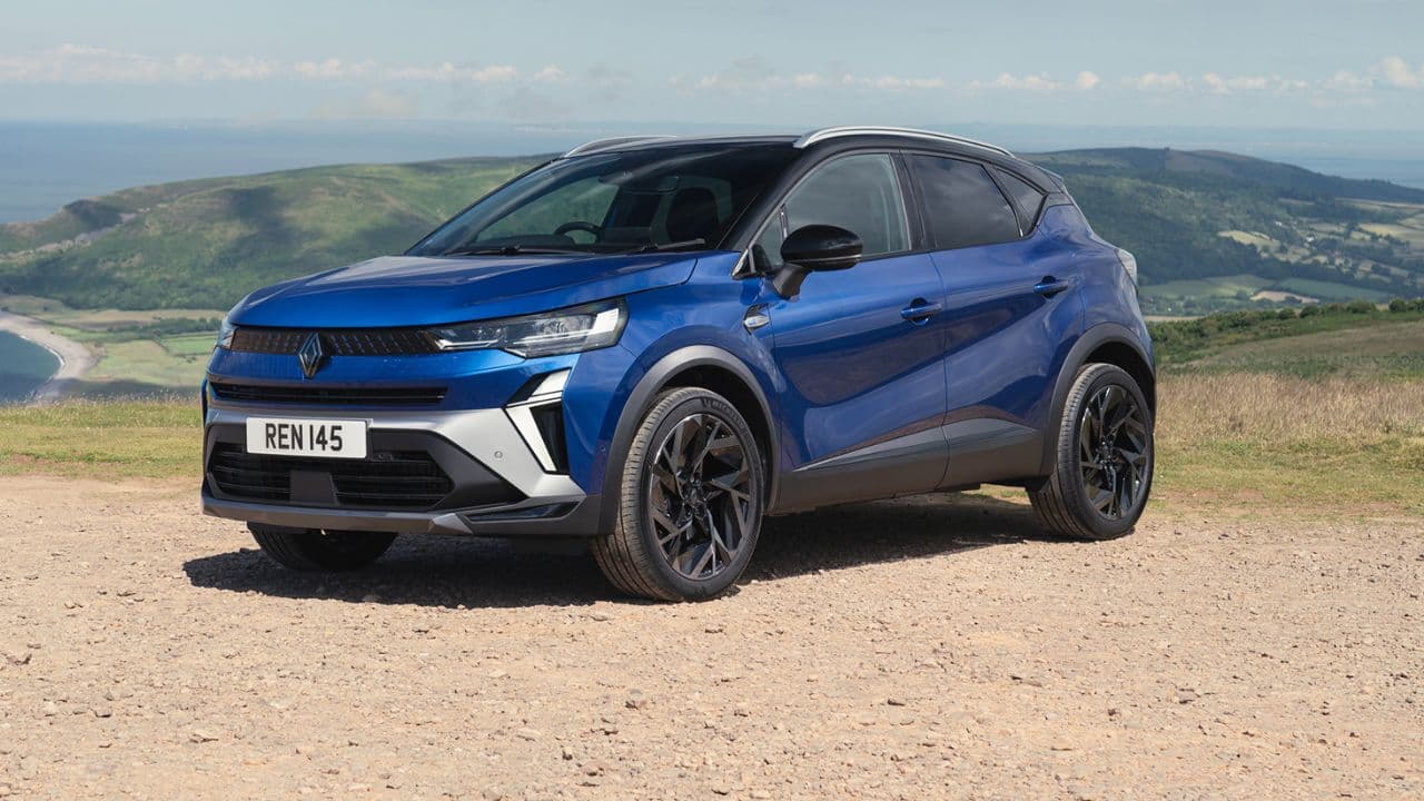 Blue Renault Captur parked on a mountain