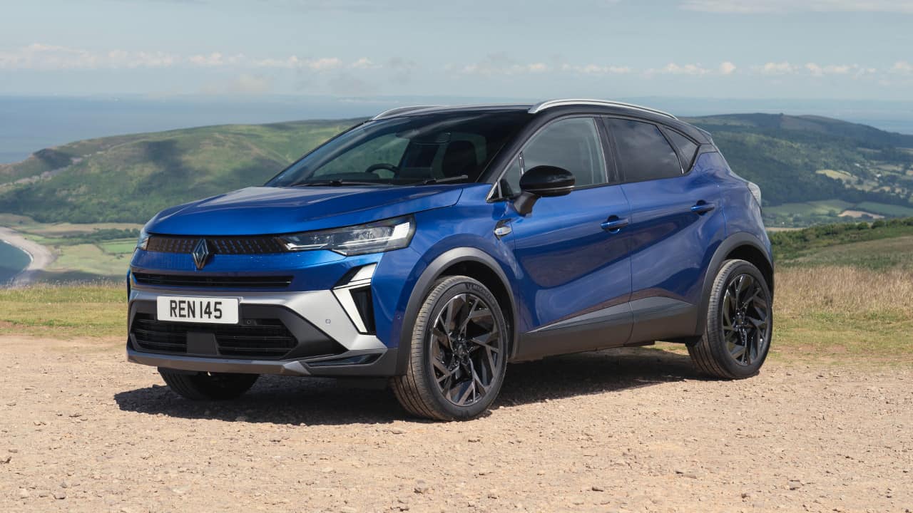 Blue Renault Clio Parked On Stone Path