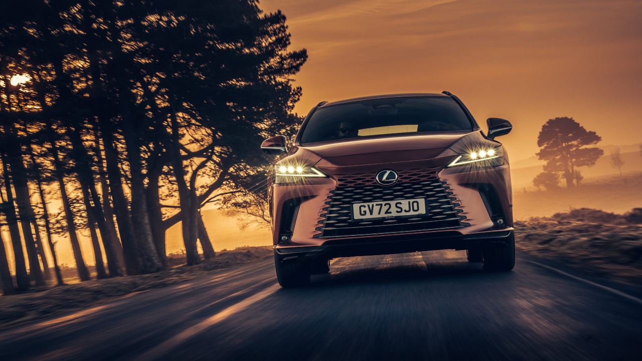 Bronze Lexus RX driving front