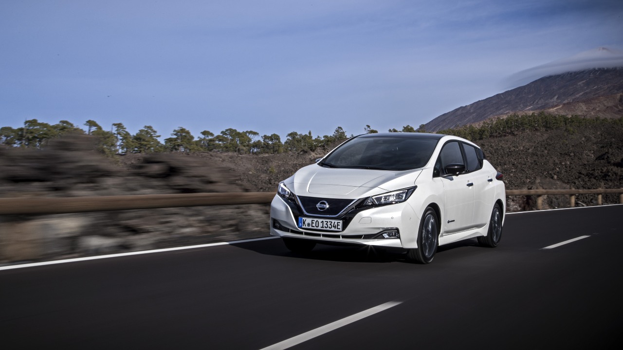 White Nissan Leaf driving