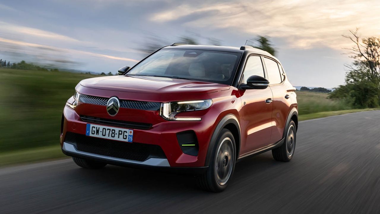 Red Citroen C3 Aircross driving on the road