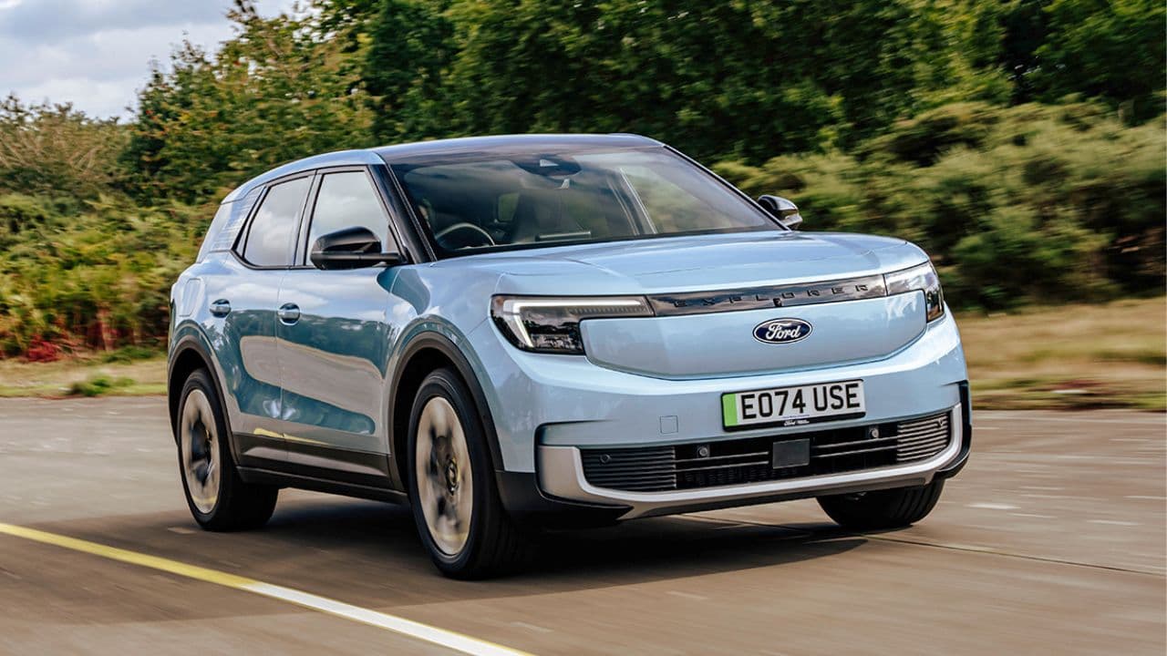 Blue Ford Explorer driving on the road