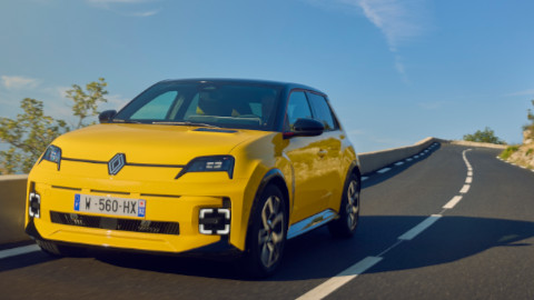 Renault 5 in Yellow Driving on Road