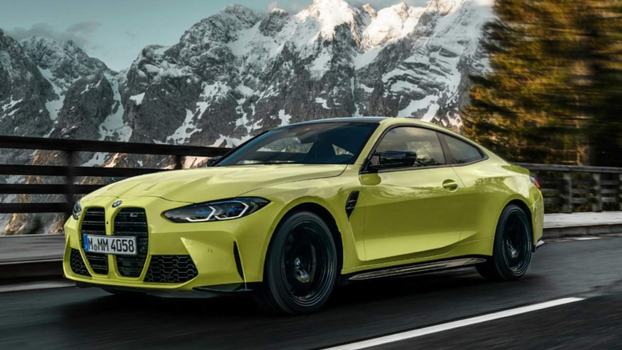 Yellow BMW M4 Competition Exterior Front Driving