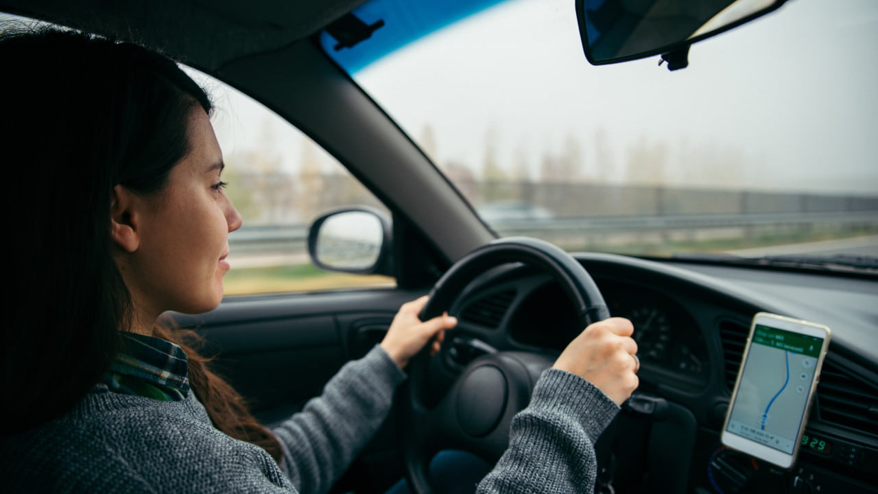 Woman Driving With Sat Nav