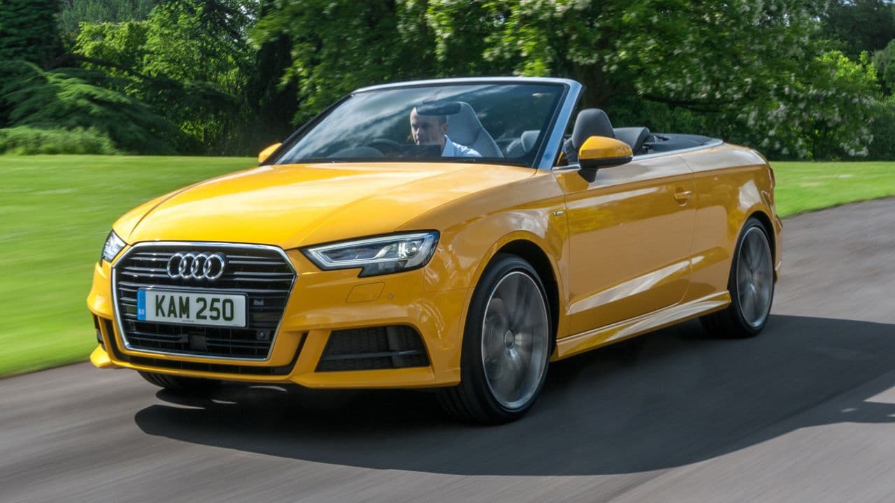 Yellow Audi A3 Cabriolet driving in the countryside