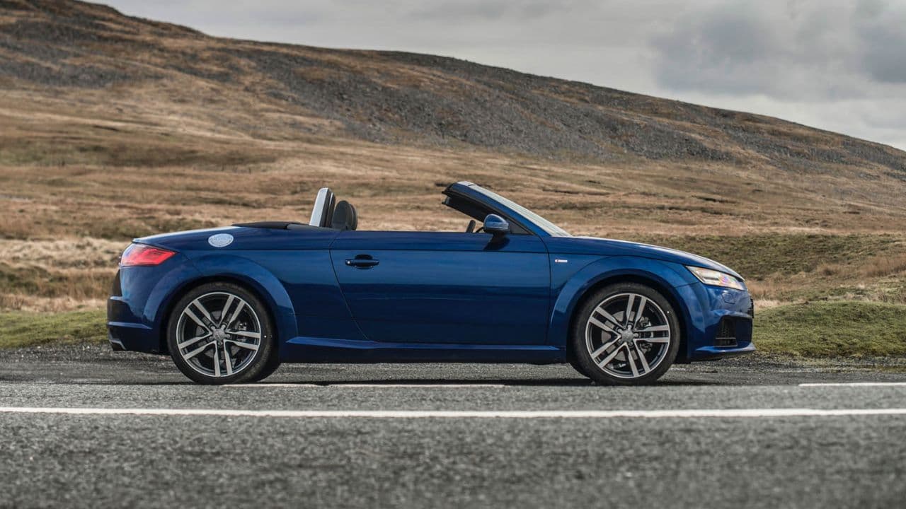 Blue Audi TT Roadster parked in a dried out countryside mountain