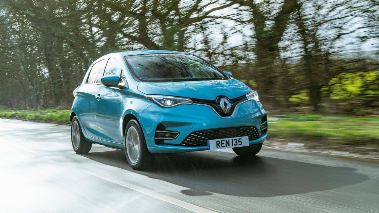 Blue Renault Zoe driving in the countryside