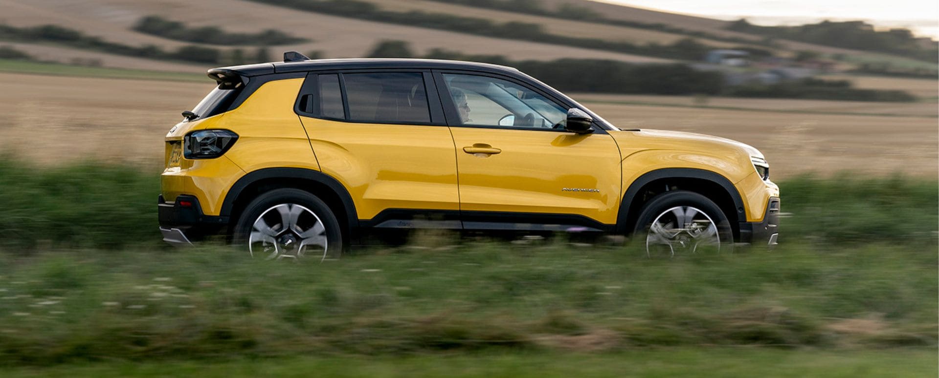 Yellow Jeep Avenger in the countryside