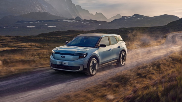 Blue Ford Explorer Exterior Front Driving Mountains