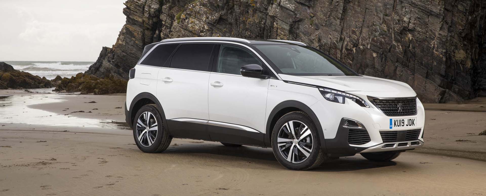 White Peugeot 5008 Parked on the Beach