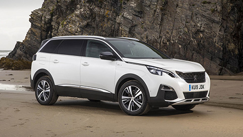 White Peugeot 5008 Parked on the Beach