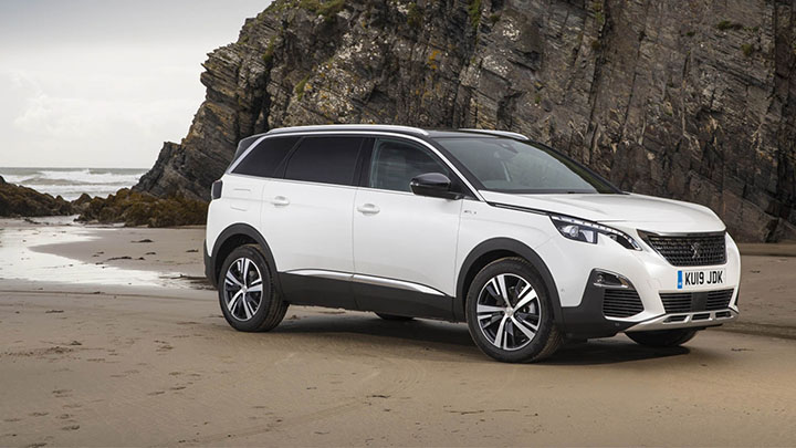 White Peugeot 5008 Parked on the Beach