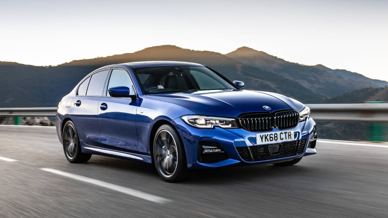 Blue BMW 3 Series, driving