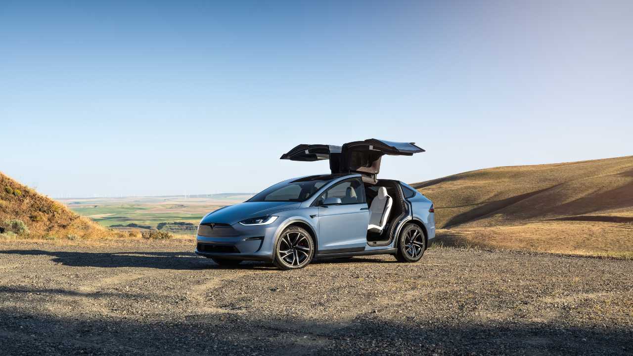 Blue Tesla Model X parked open doors