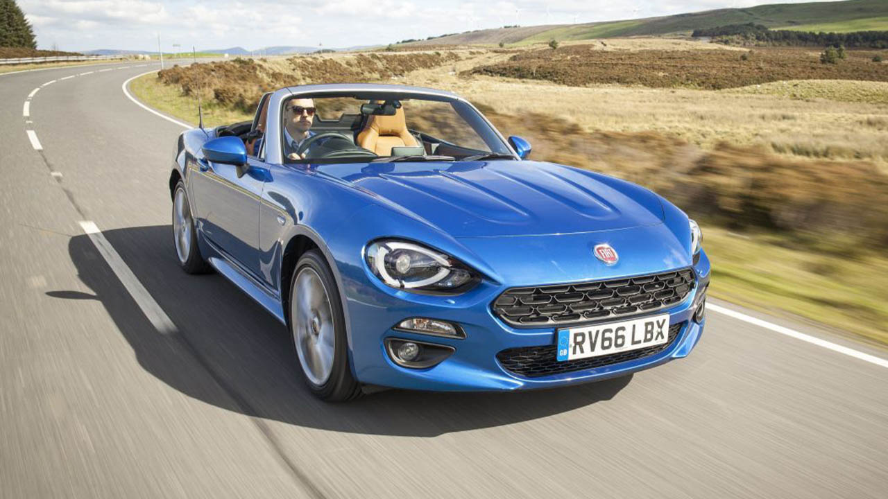 blue fiat 124 spider, driving