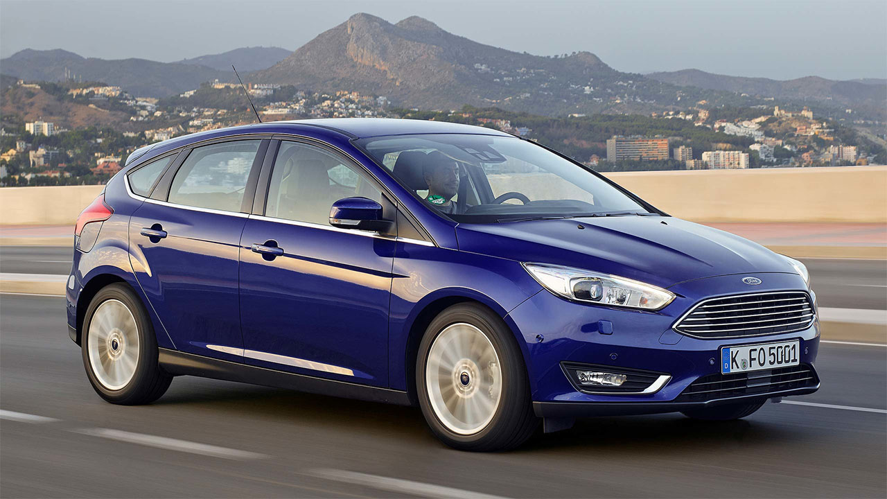 Blue Ford Focus, driving